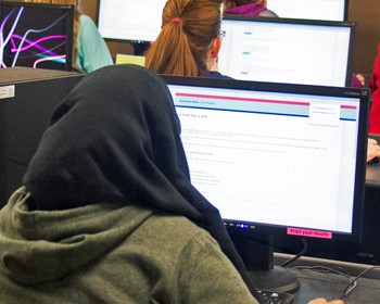 students at computers in testing center