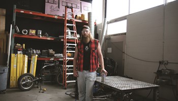 Student Spencer Cleland pictured in glassblowing workshop.