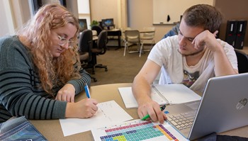 Tutor helping student