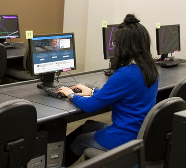 student at computer in testing center