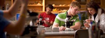 Student with instructor in a biology lab
