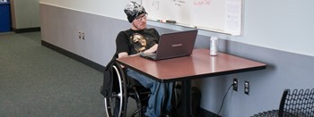 student in wheelchair studying