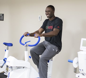 Mikhail Morrison on exercise bike
