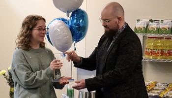 Anoka-Ramsey Community College Student Senate President Emily Gangl receives Hunger Free Campus award from LeadMN President John Runningen