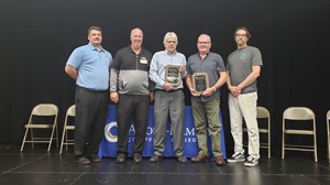 Pictured (L to R): Senior Human Resources Officer Jay Nelson, Anoka-Ramsey President Kent Hanson, Daniel Hoffman (accepting for his late wife Kathleen Hoffman), Brad Wold, MN State College Faculty Cambridge President Bill Breen